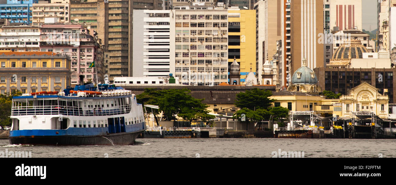 Ferry with buildings of Rio de Janeiro as seen from a boat on Baia de Guanabara, Brazil Stock Photo