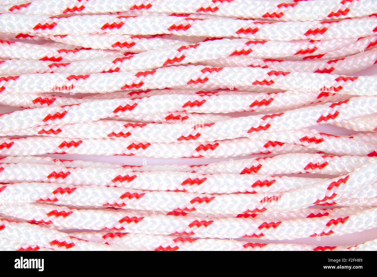 Red and white rope as a background Stock Photo - Alamy