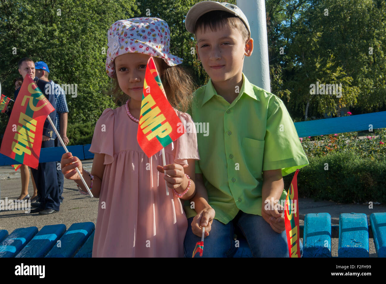 Transnistrian Kids Waiving Flags - 25th Anniversary of the Pridnestrovian Moldavian Republic PMR, Transnistria, Soviet USSR Stock Photo