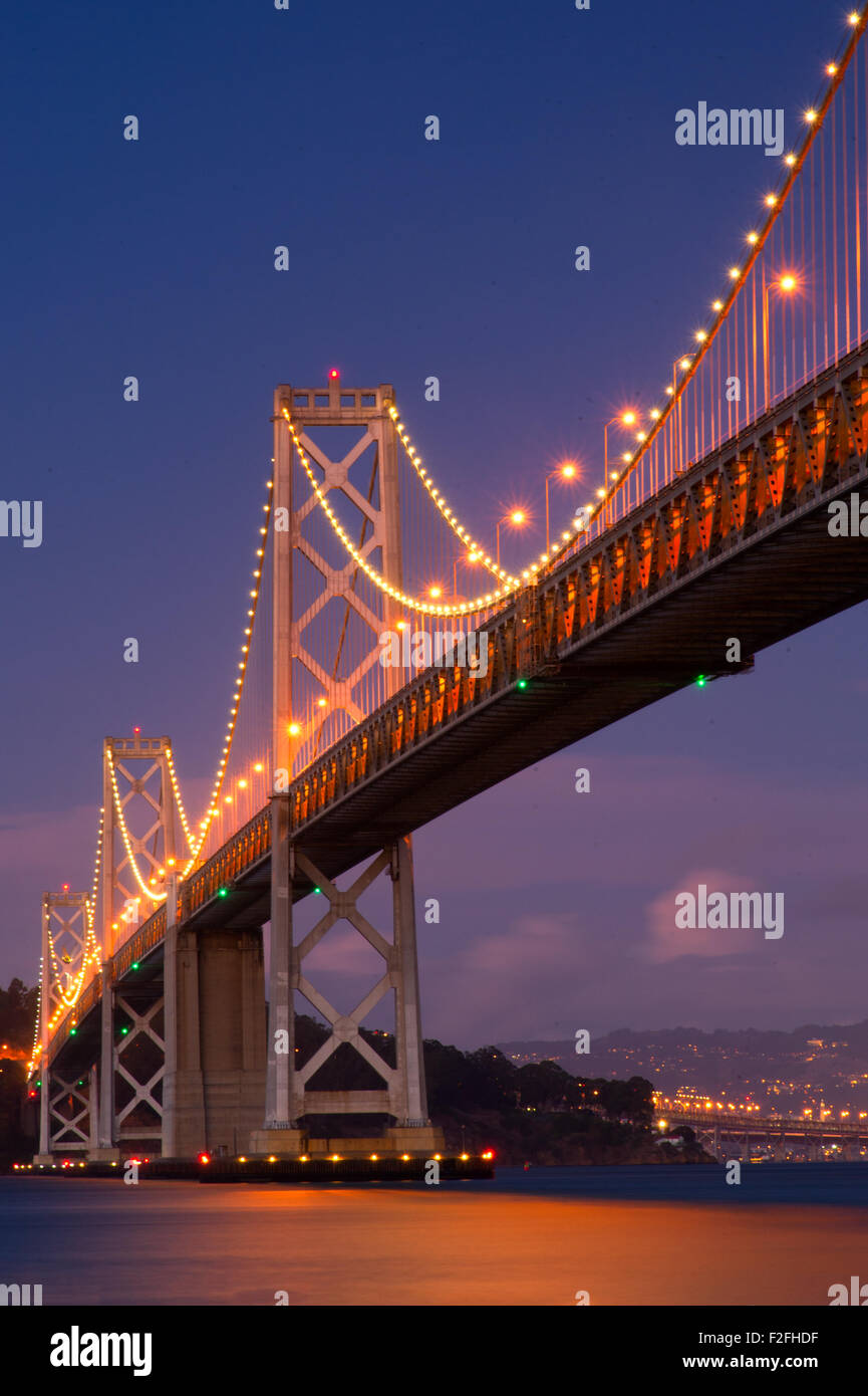 Suspension bridge lit up at night, Bay Bridge, San Francisco Bay, San Francisco, California, USA Stock Photo