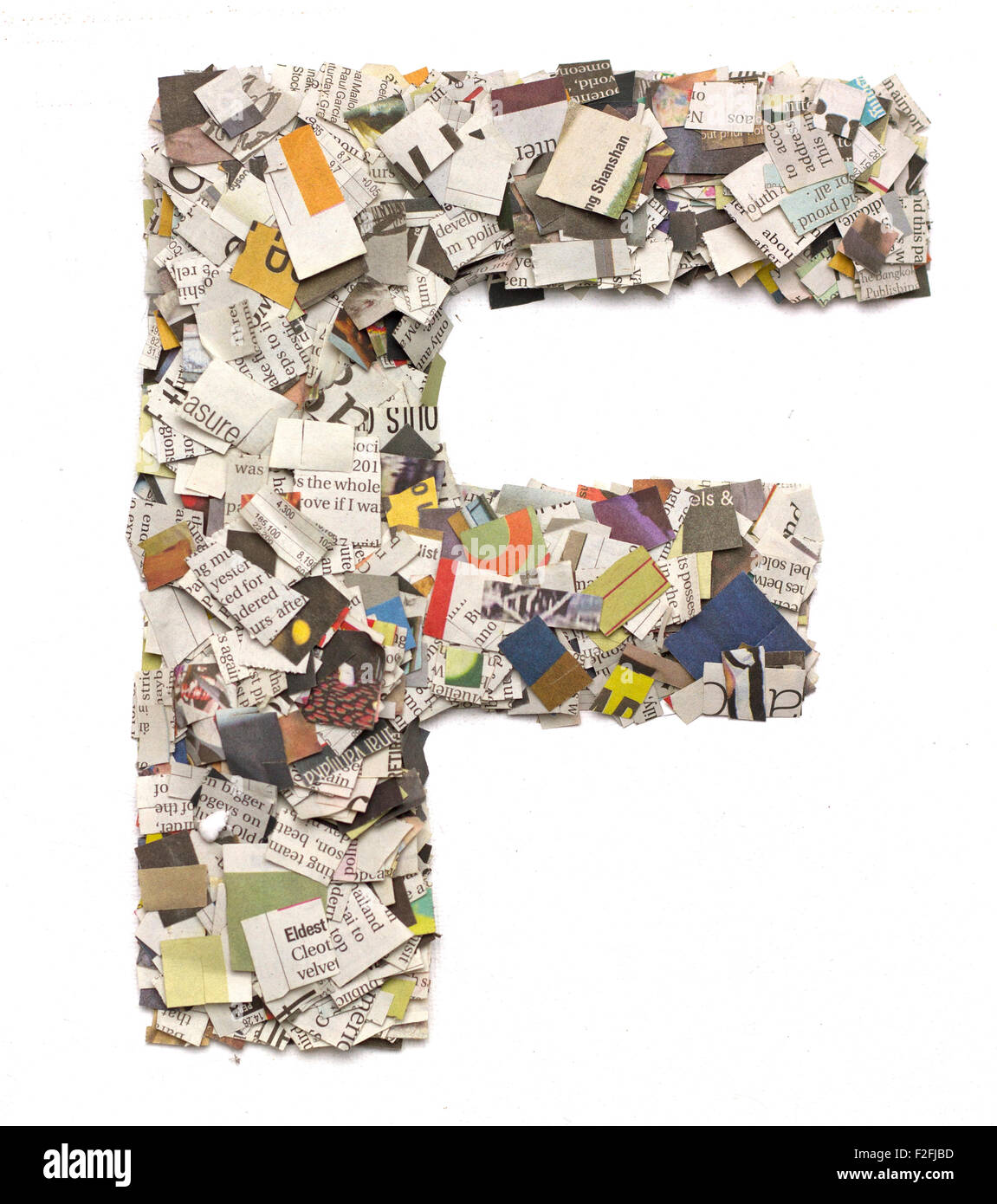 The letter F made from newspaper confetti Stock Photo Alamy