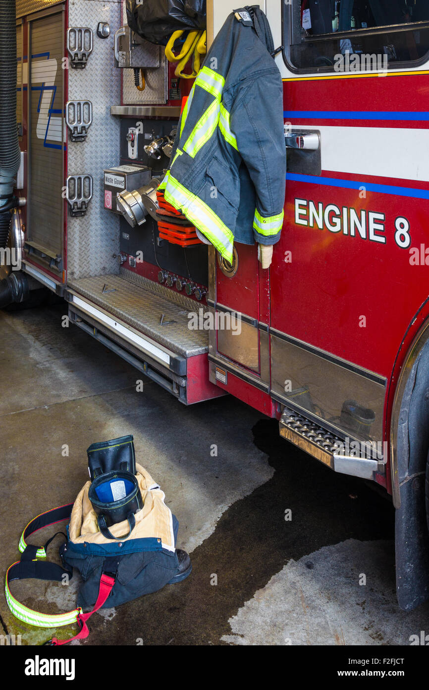 Pants, boots, and jacket ready for an emergency call at a Vancouver Fire Hall Stock Photo
