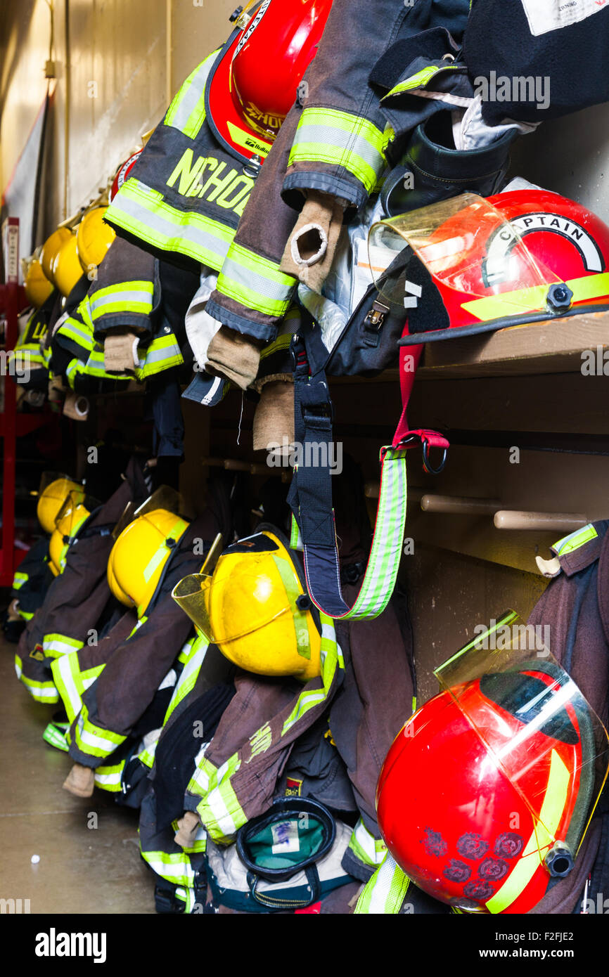 Rack of Fireman's clothing in a Vancouver Fire Hall Stock Photo