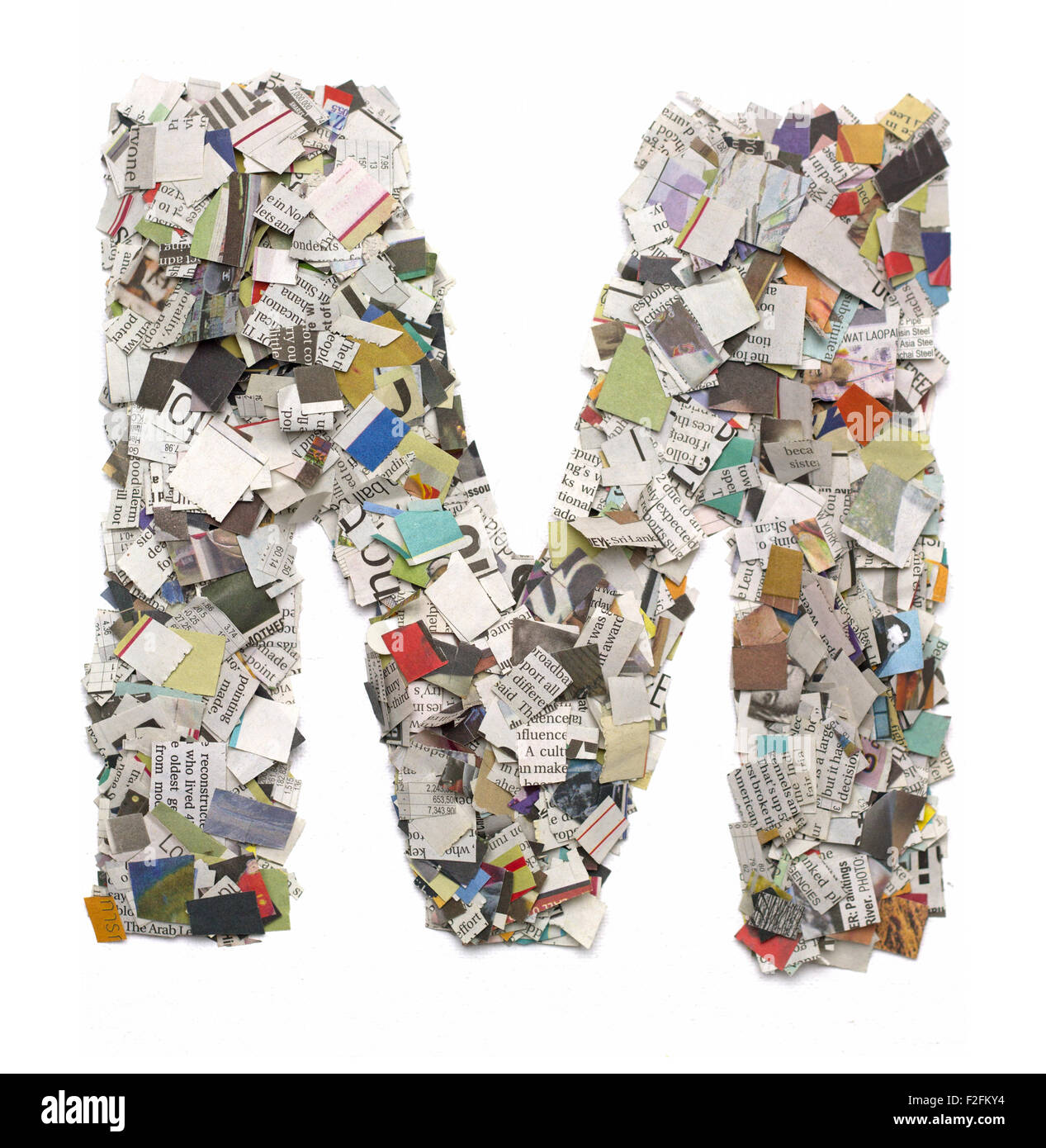 The letter M made from newspaper confetti Stock Photo Alamy