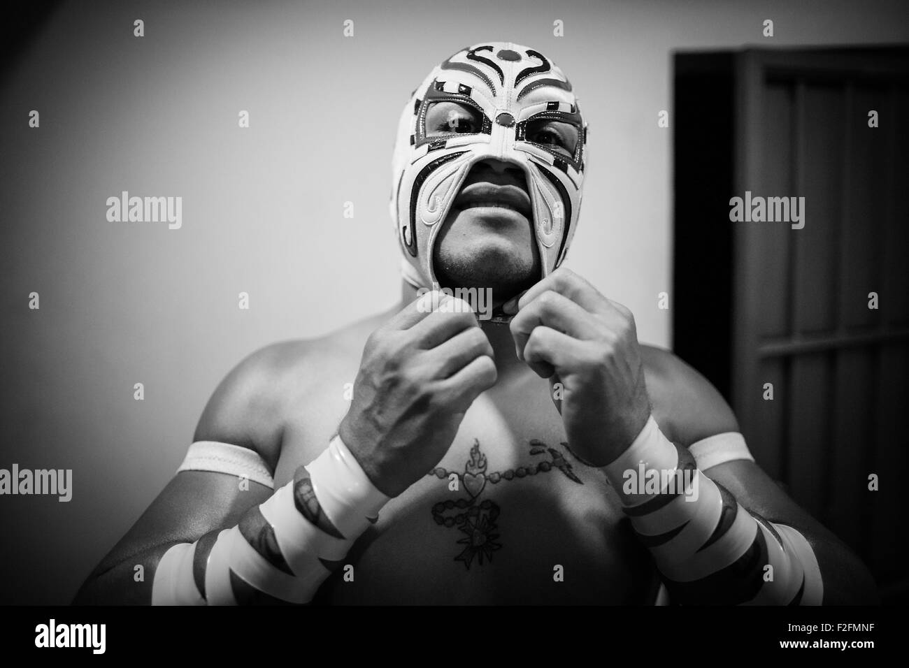 Mexico City, Mexico. 8th Sep, 2015. Luchador Triton prepares prior to the lucha libre at Arena Mexico in Mexico City, capital of Mexico, on Sept. 8, 2015. Lucha Libre is authentic Mexican free wrestling and features strong men in mysterious and elaborate masks. Triton, 28 years old, is considered as one of the young promises of the World Wrestling Council for Lucha Libre. Arena Mexico, also known as the "Cathedral of Lucha Libre", is the biggest arena in the country for this kind of matches. In 2015, Arena Mexico will host the 82nd anniversary of the CMLL. © Pedro Mera/Xinhua/Alamy Live News Stock Photo