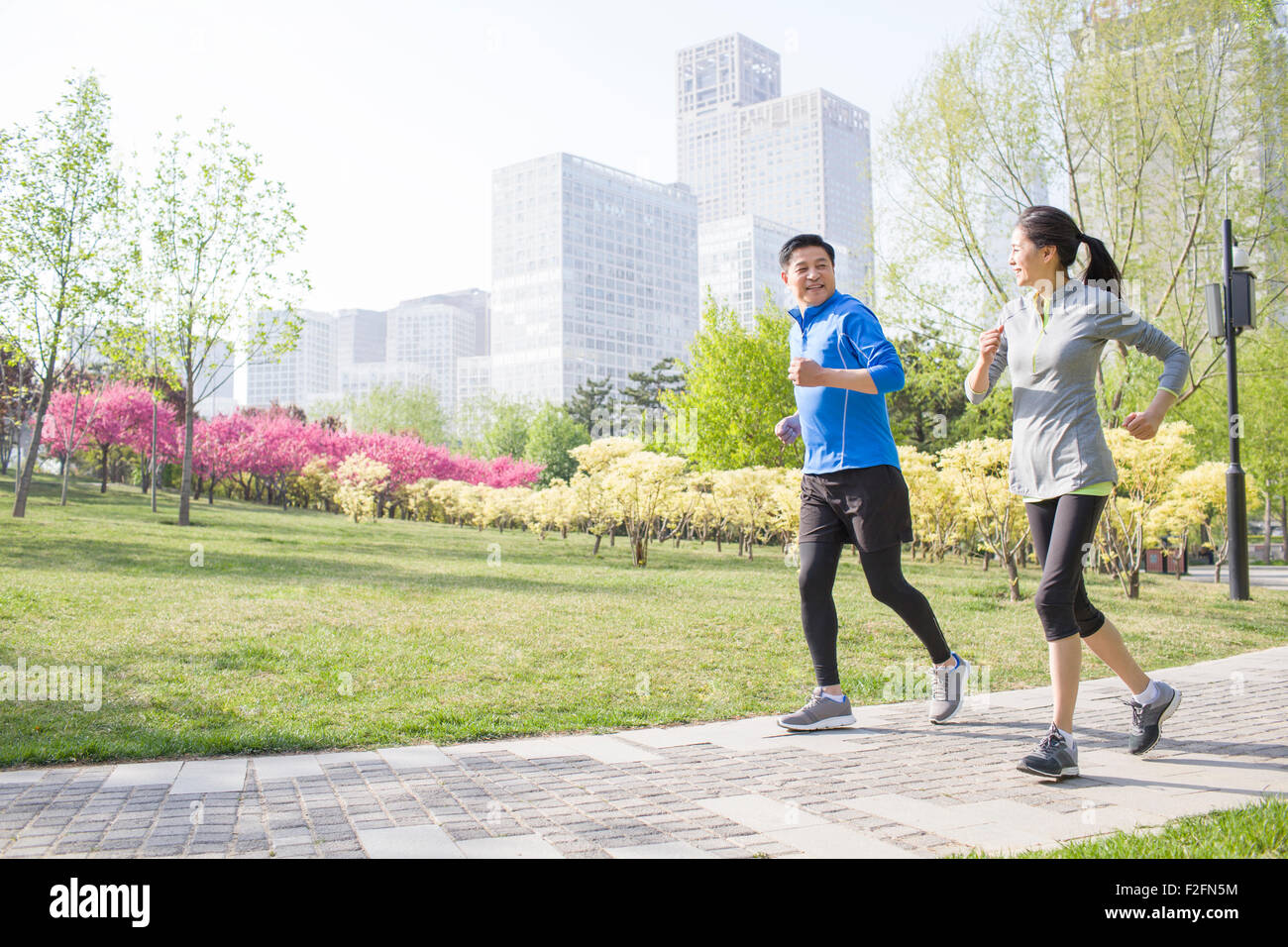 Indian couple jogging in park hi-res stock photography and images - Alamy