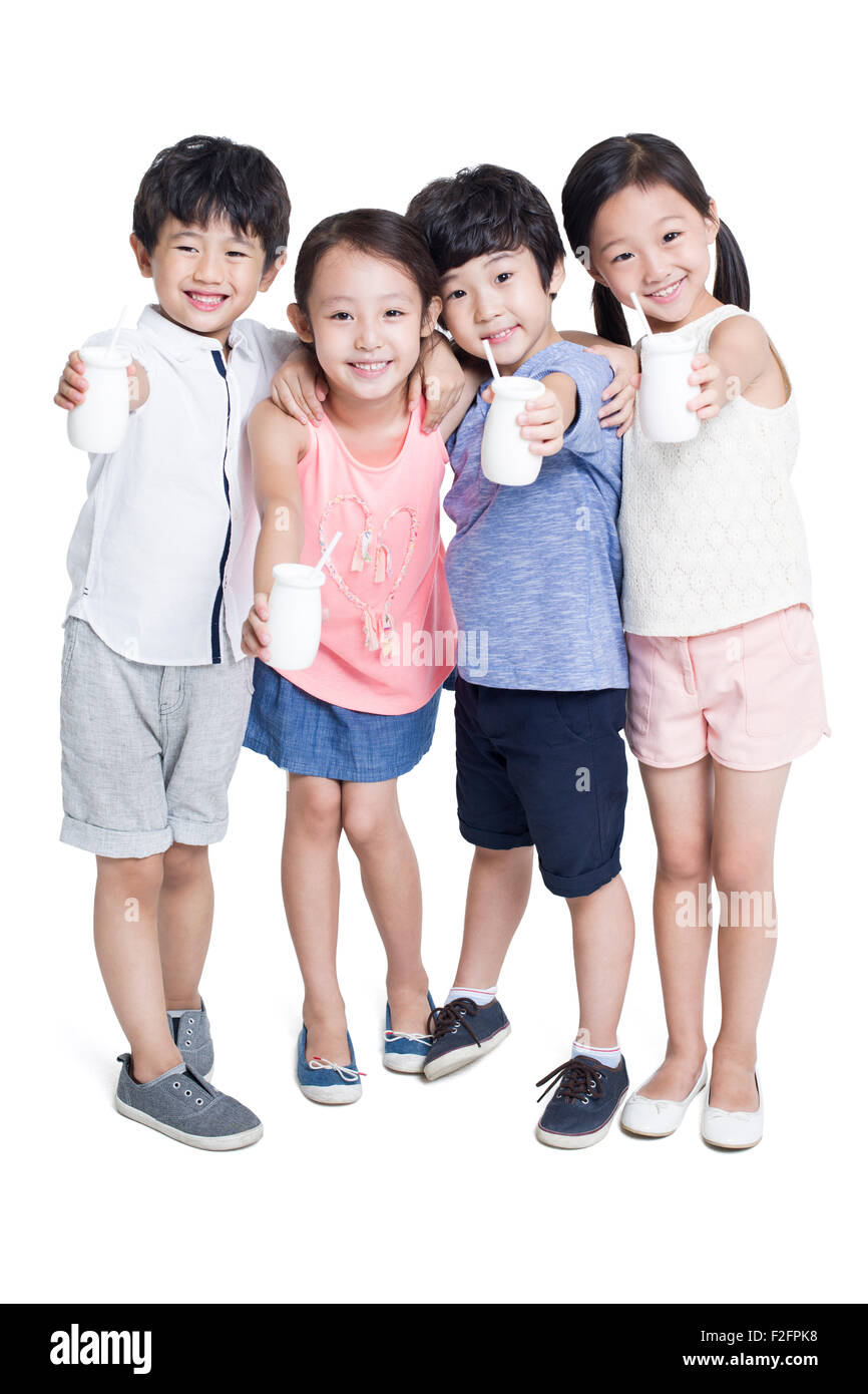 Happy children drinking yogurt Stock Photo - Alamy