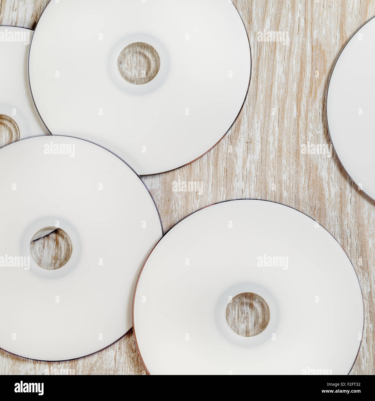 Blank printable CD and DVD on light wooden background. Top view Stock ...