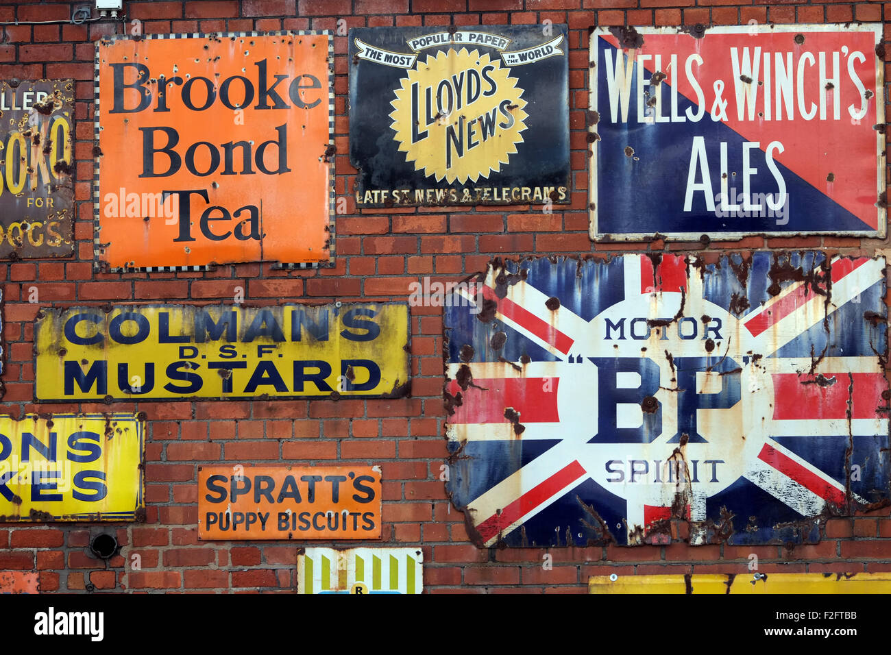 Vintage enamel advertising signs at Bygone Times antiques centre, Eccleston, Chorley, , Lancashire, England UK Stock Photo