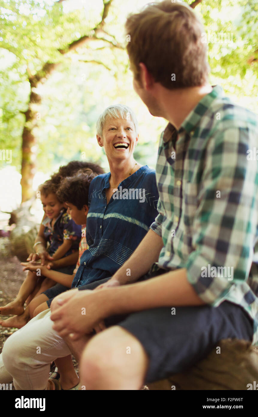 Mother and son laughing in woods Stock Photo