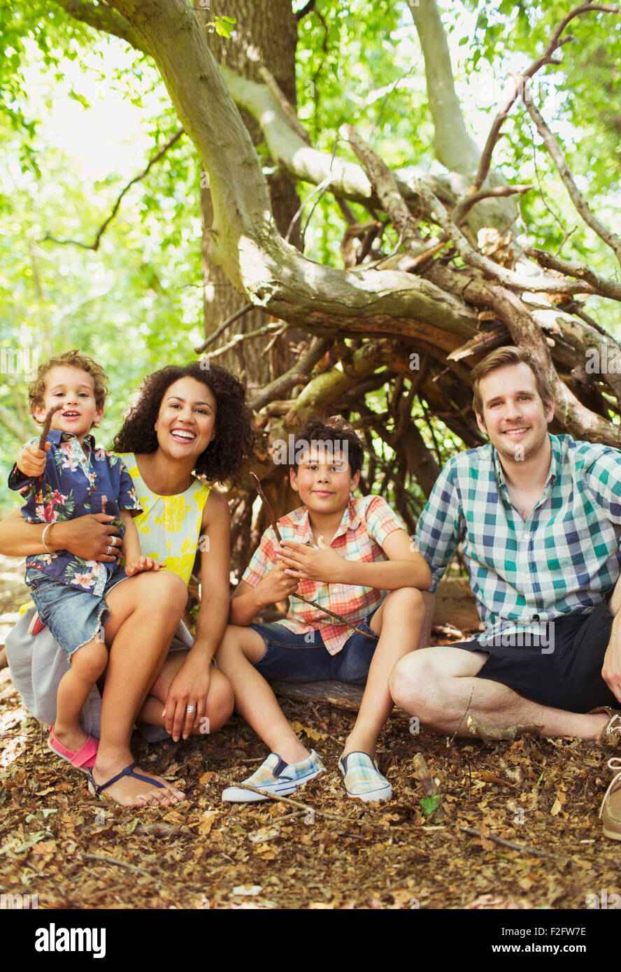 Portrait smiling family in woods Stock Photo