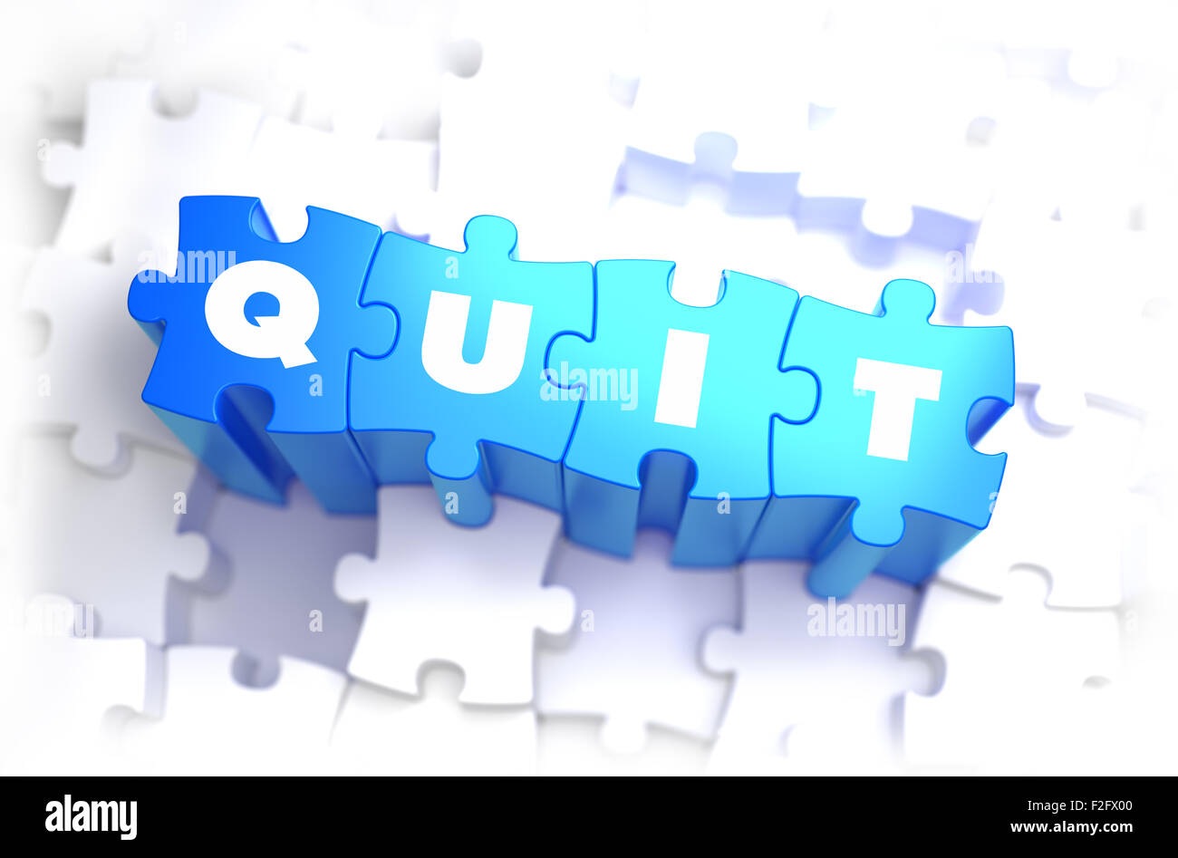 Quit - Text on Blue Puzzles on White Background. 3D Render. Stock Photo