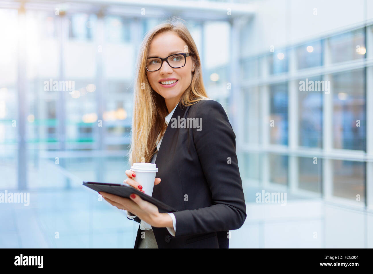 Businesswoman having a coffee break Stock Photo - Alamy