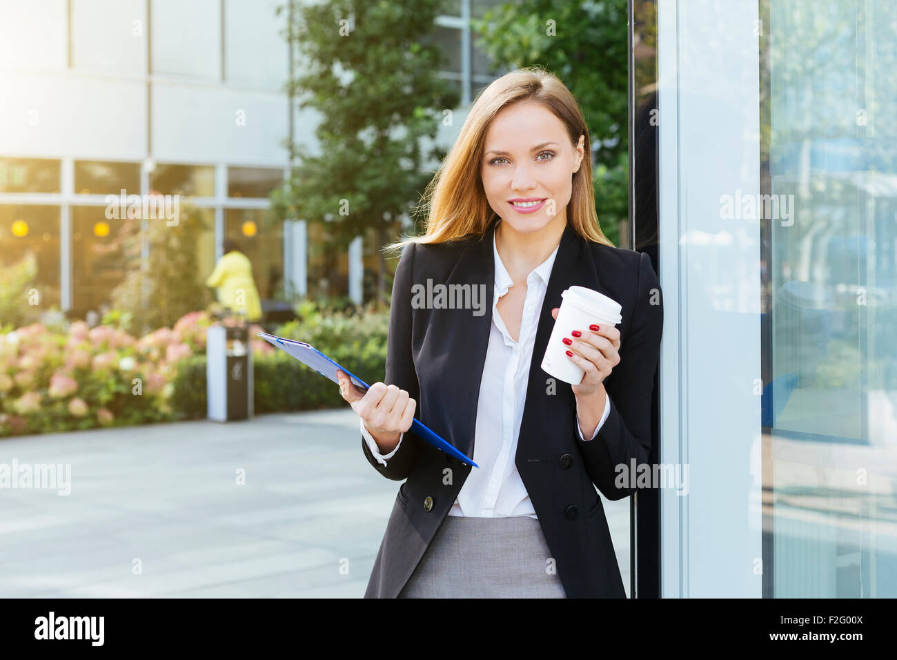 Businesswoman having a coffee break Stock Photo - Alamy