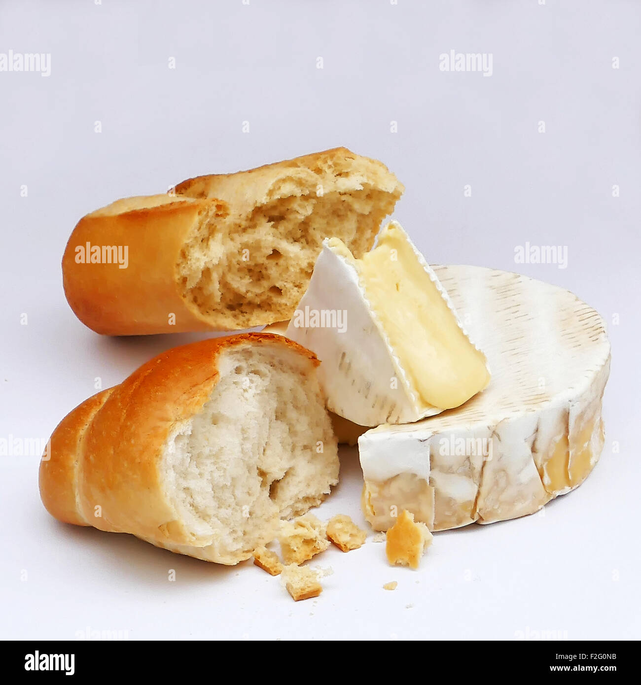 Camembert cheese with chunks of French bread Stock Photo