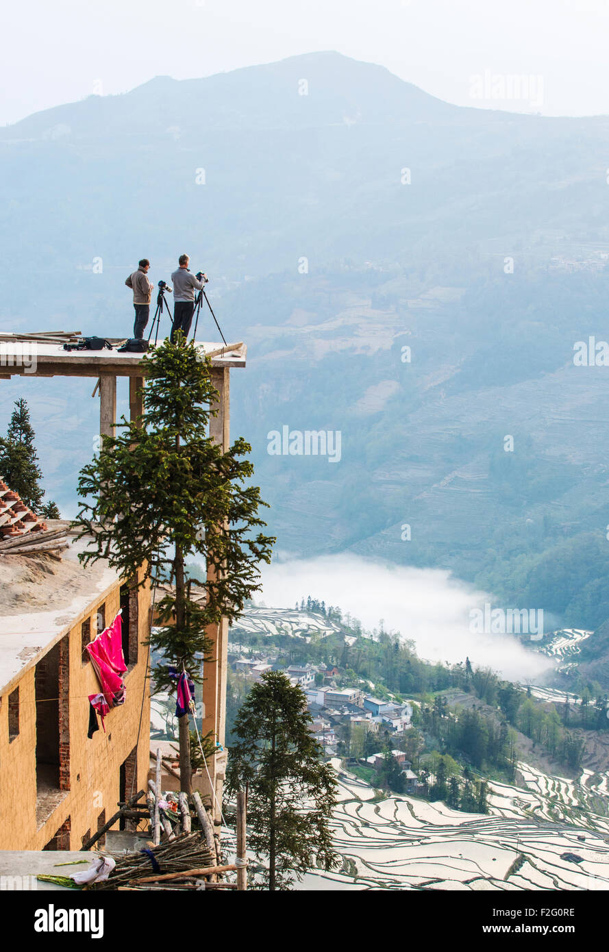 Photographers taking pictures of the rice terraces in Yuanyang, Yunnan, China Stock Photo