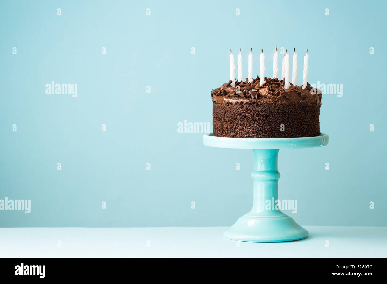 Chocolate birthday cake with blown out candles Stock Photo Alamy