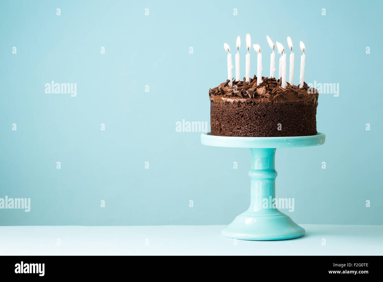 Chocolate birthday cake with candles Stock Photo Alamy