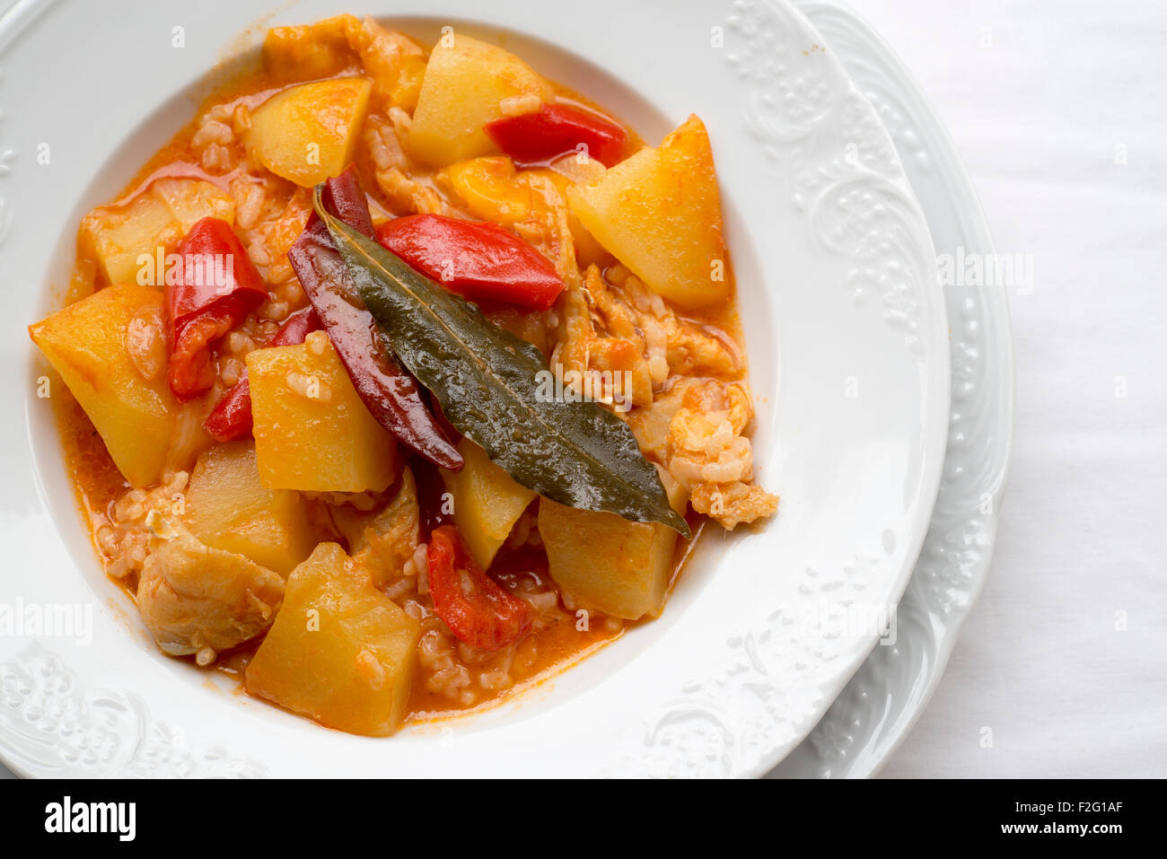 cod cooked with potatoes and rice Stock Photo