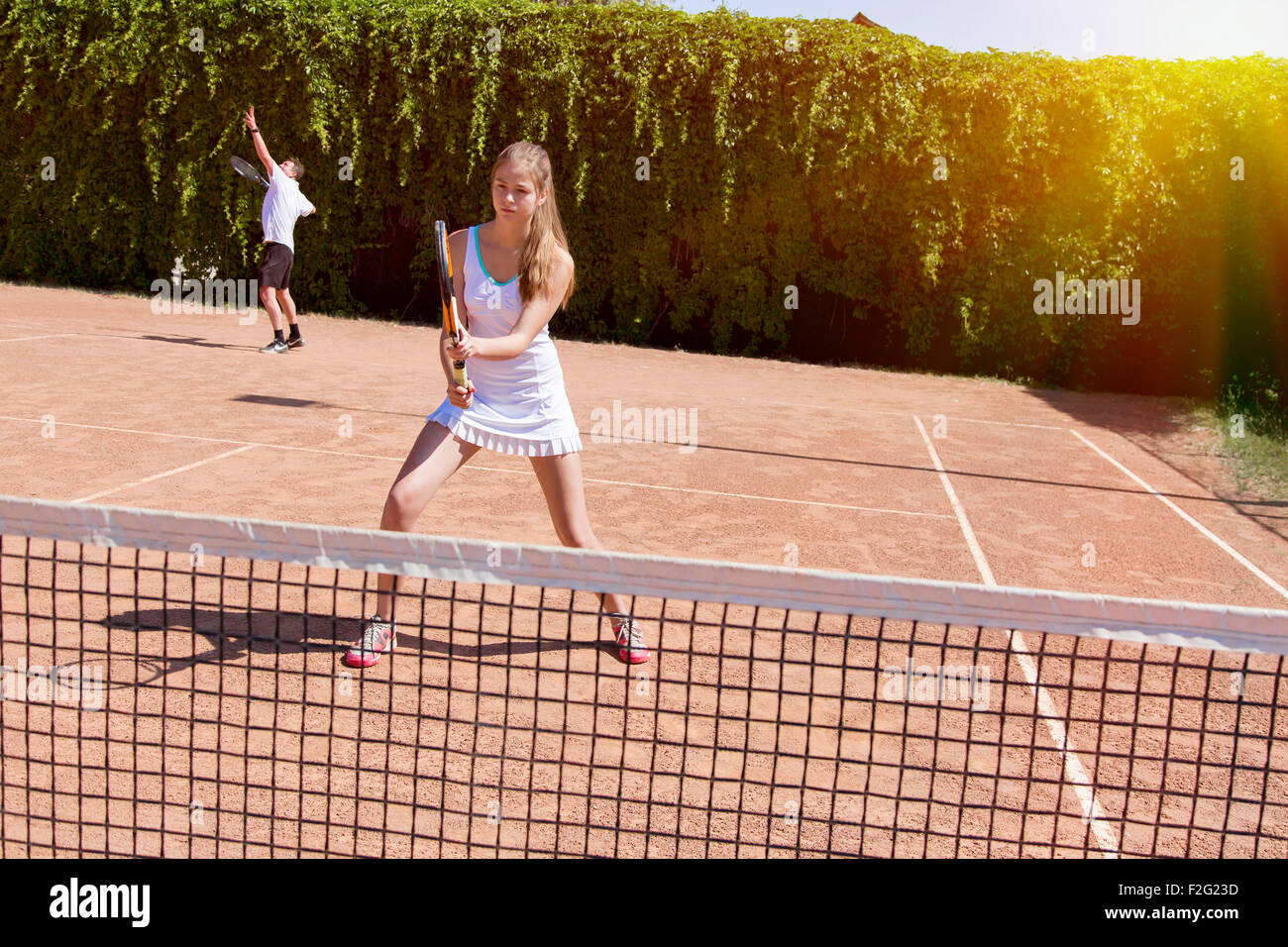 Two athletes on tennis court Stock Photo