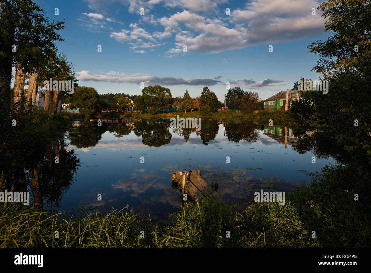 Blue sky and clouds reflected in pond hi-res stock photography and ...