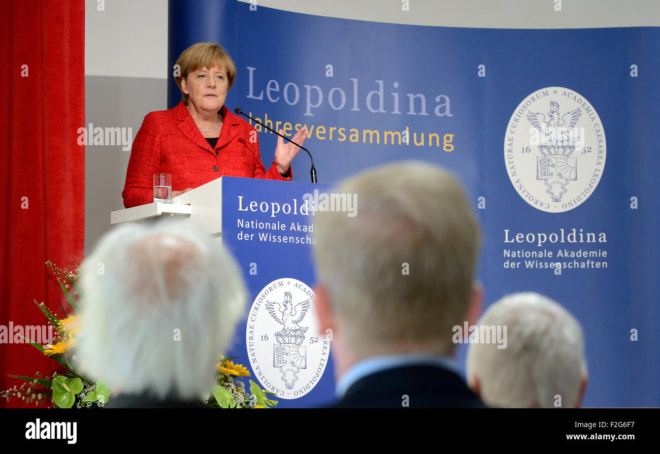 Halle, Germany. 18th Sep, 2015. German Chancellor (CDU) Angela Merkel gives a key note address at the annual meeting being held at the Leopoldina German National Academy for Sciences in Halle, Germany, 18 September 2015. The event this year is being held under the title 'Symmetry and asymmetry in science and art' Photo: HENDRIK SCHMIDT/DPA/Alamy Live News Stock Photo
