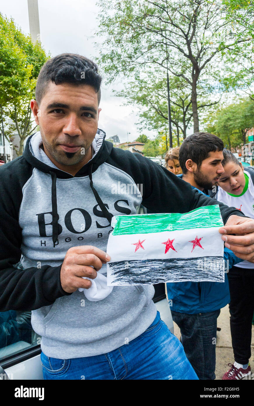 Paris, France. Portrait Man refugees men, Holding Home made Syrian Flag, Camp of Refugees, france migrant protests Stock Photo