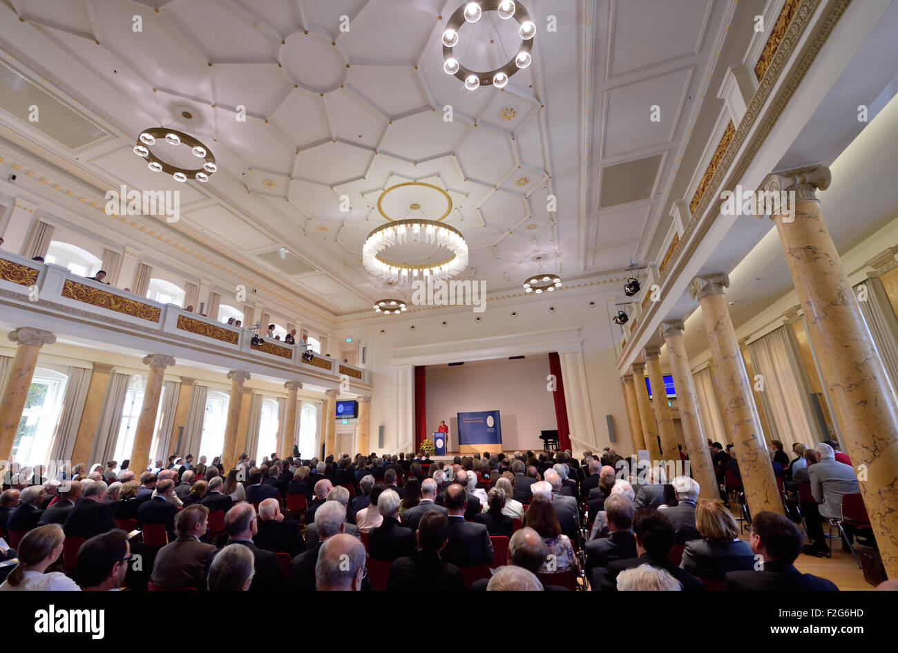 Halle, Germany. 18th Sep, 2015. German Chancellor (CDU) Angela Merkel gives a key note address at the annual meeting being held at the Leopoldina German National Academy for Sciences in Halle, Germany, 18 September 2015. The event this year is being held under the title 'Symmetry and asymmetry in science and art' Photo: HENDRIK SCHMIDT/DPA/Alamy Live News Stock Photo