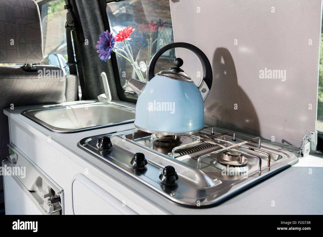 VW Volkswagen T4 camper van kitchen, cooker hob and kettle Stock Photo