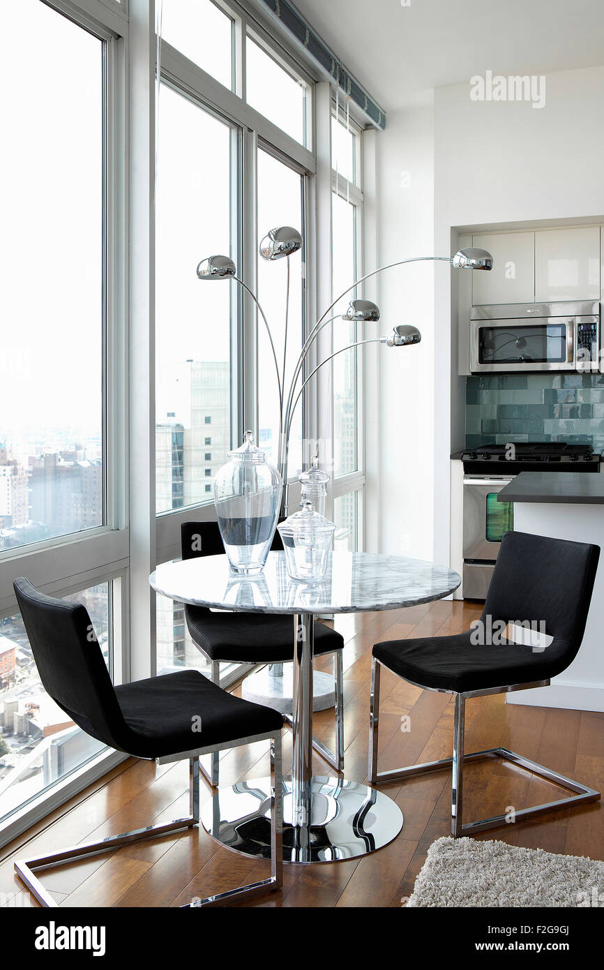 Modern dining room in city apartment Stock Photo