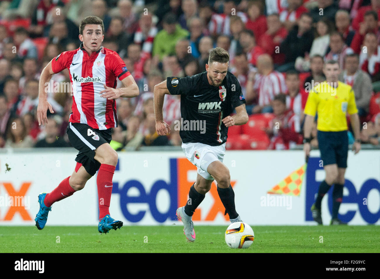 Bilbao, Spain. 17th Sep, 2015. Tim Matavz (R) of Augsburg and Aimeric Laporte of Bilbao vie for the ball during the UEFA Europa League Group L soccer match between Athletic Bilbao and FC Augsburg at Estadio de San Mames in Bilbao, Spain, 17 September 2015. Photo: Juan Flor/dpa/Alamy Live News Stock Photo