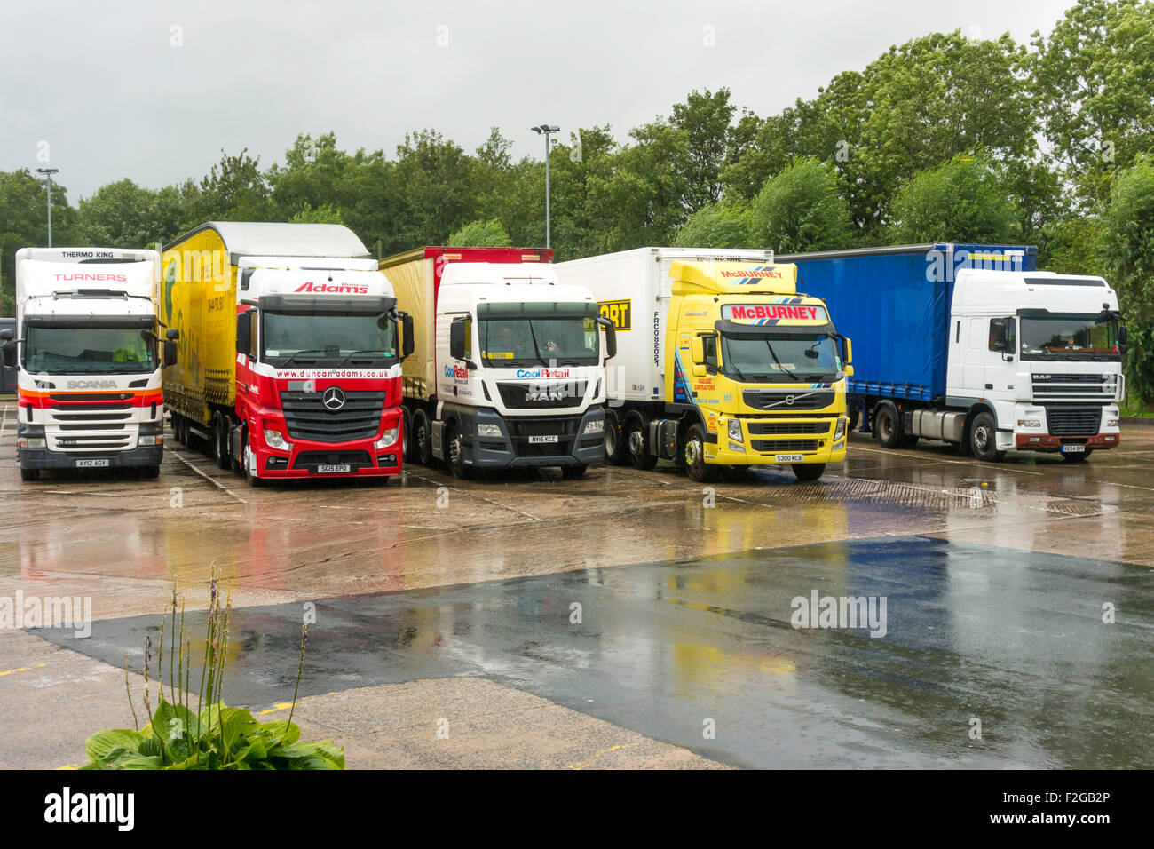Lorries parked at the Tebay Truck Stop at Junction 38 on the M6 motorway, Cumbria England UK. Stock Photo