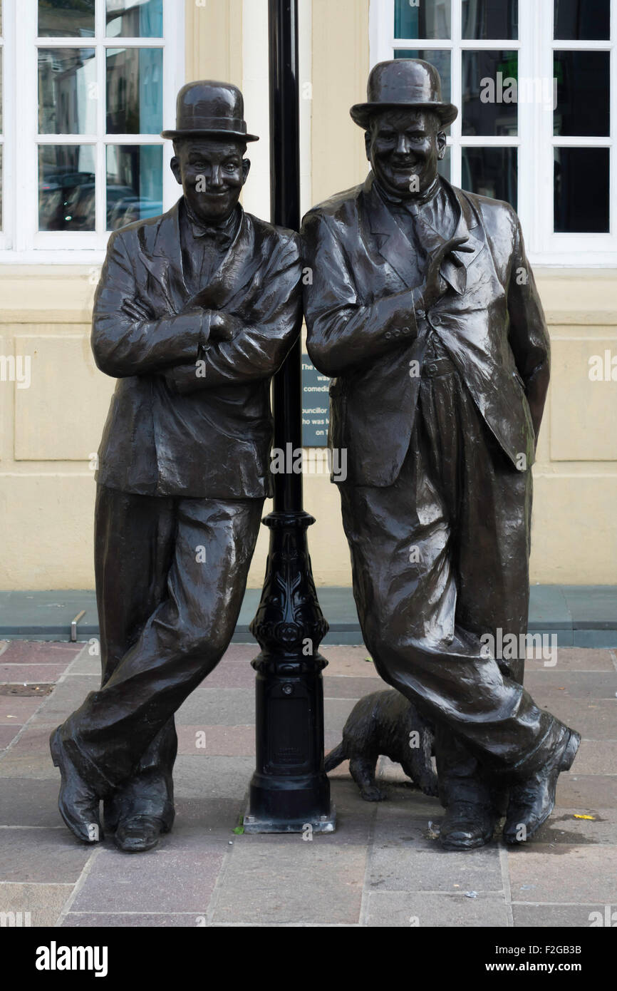 Statues of film comedy actors Stan Laurel and Oliver Hardy outside the Coronation Hall Theatre in Laurel's home town Ulverston Stock Photo