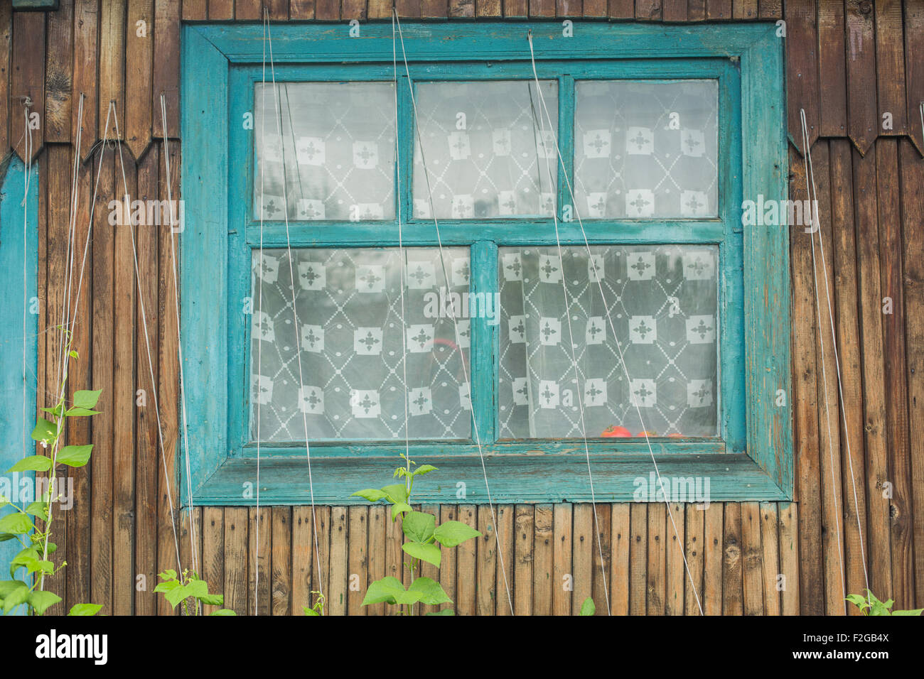 Old window of a wooden house wall Stock Photo - Alamy