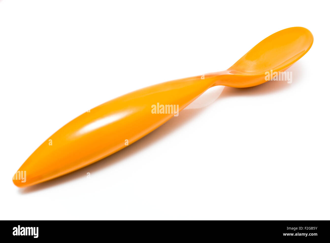 Orange plastic spoon isolated on white Stock Photo Alamy