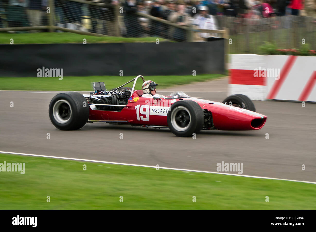 Sir Jackie Stewart driving an Ex-Bruce Mclaren F! car from the 1960's at the Goodwood Revival meeting Stock Photo