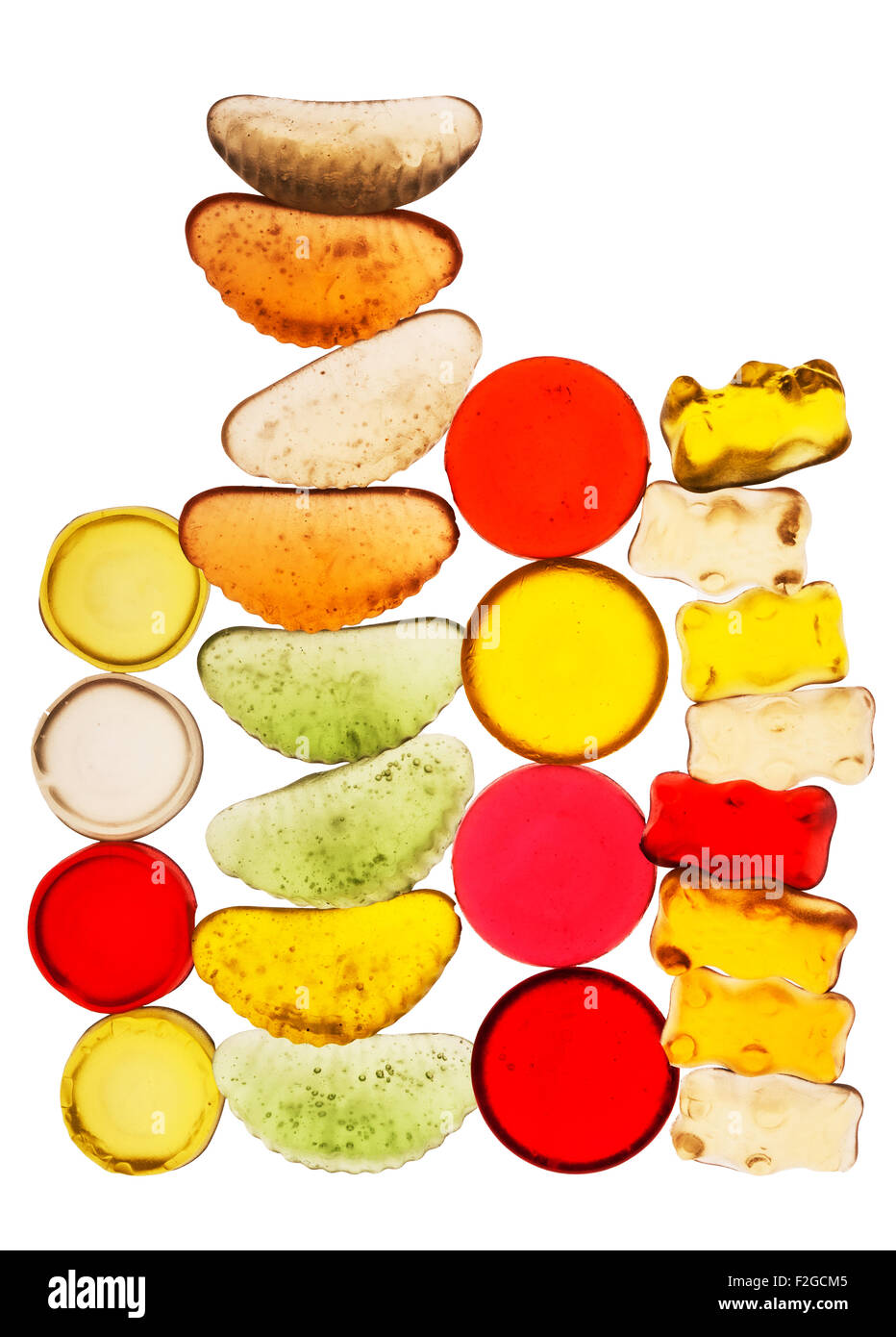 brightly colored translucent candy stacked into four vertical towers Stock Photo