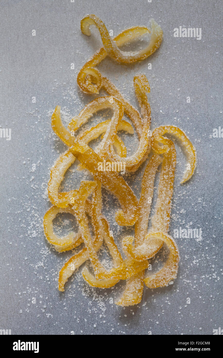 candied lemon peel with sugar on a metal background Stock Photo