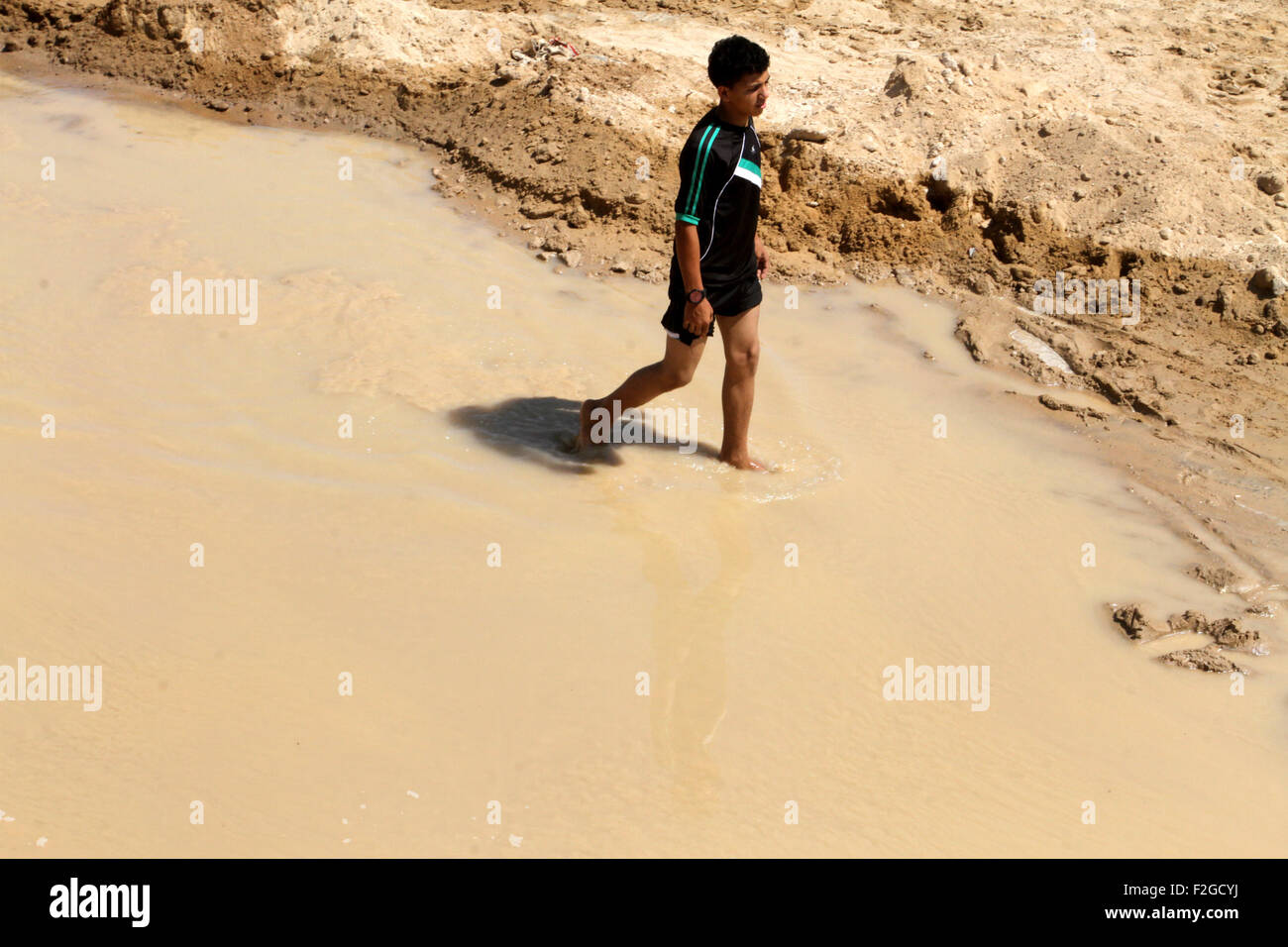 Rafah, Gaza Strip, Palestinian Territory. 18th Sep, 2015. A Palestinian boy inspects the damage after Egyptian forces flooded smuggling tunnels dug beneath the Gaza-Egypt border, in Rafah in the southern Gaza Strip September 18, 2015. According to Palestinian witnesses, the Egyptian authorities pumped water from the Mediterranean Sea through pipes to destroy the tunnels Credit:  Abed Rahim Khatib/APA Images/ZUMA Wire/Alamy Live News Stock Photo