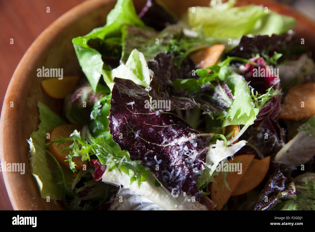 chicory salad in wooden bowl Stock Photo