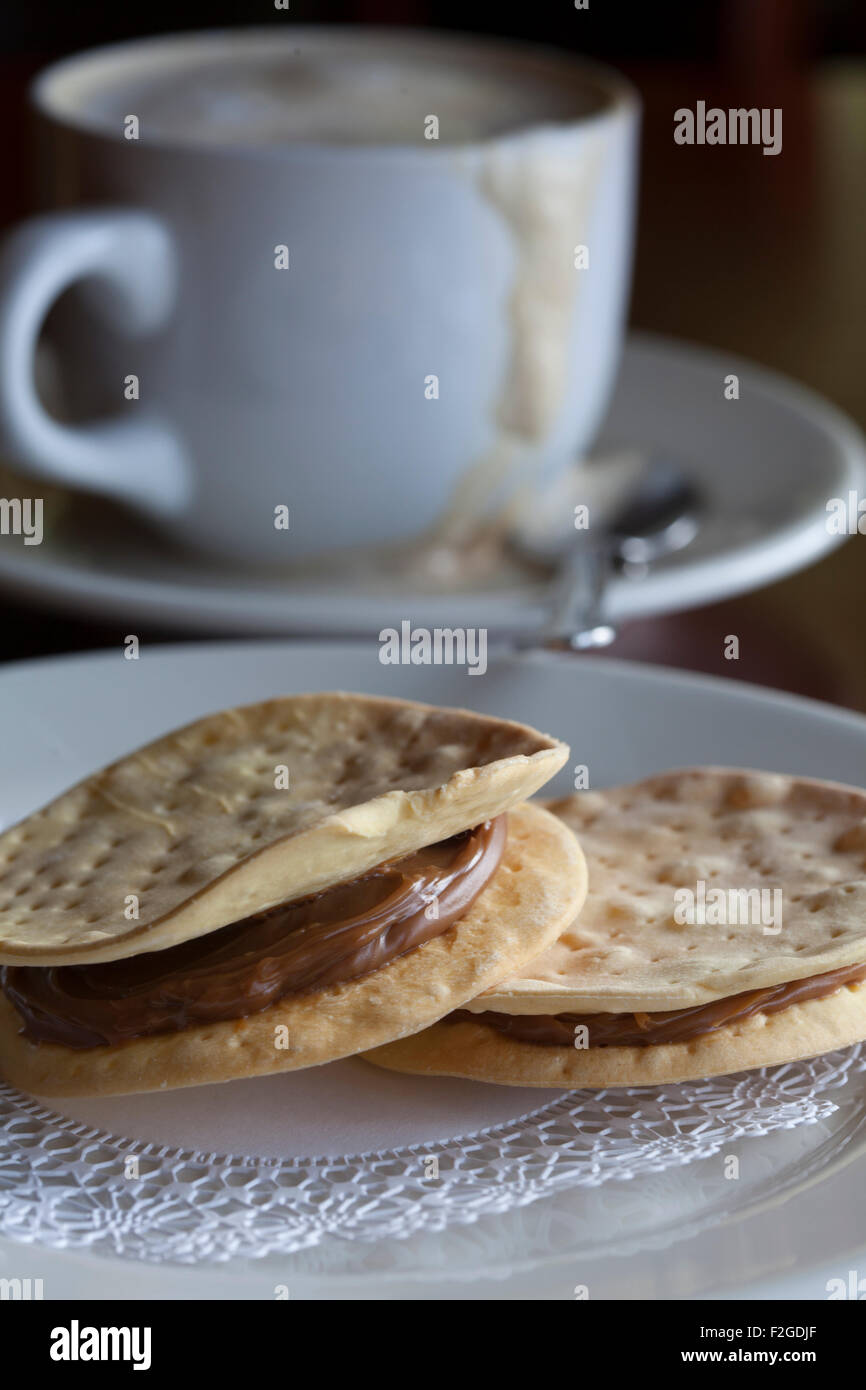 Alfajores  with coffee latte in background Stock Photo