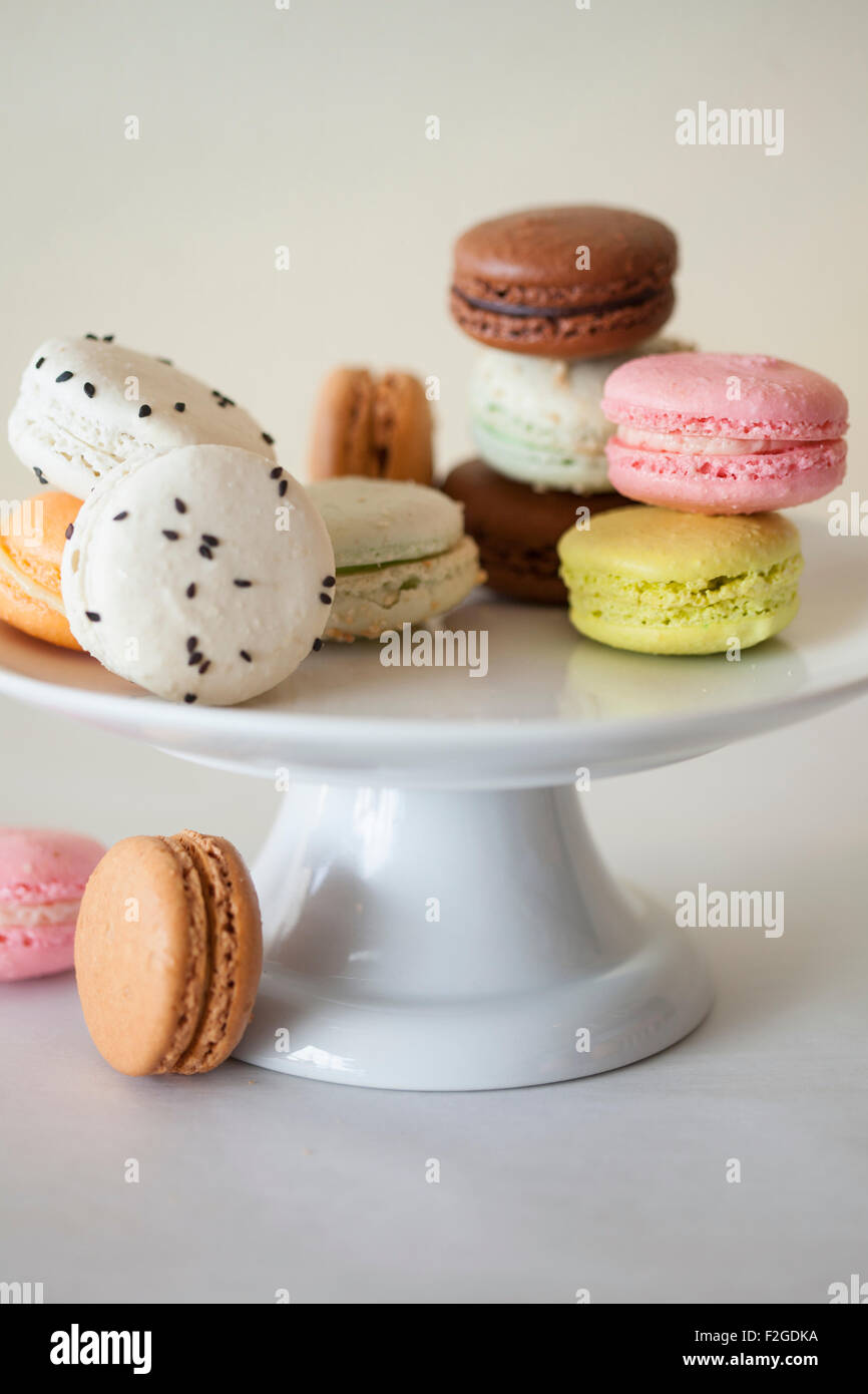 various macaroons flavors and colors on a white cake stand Stock Photo