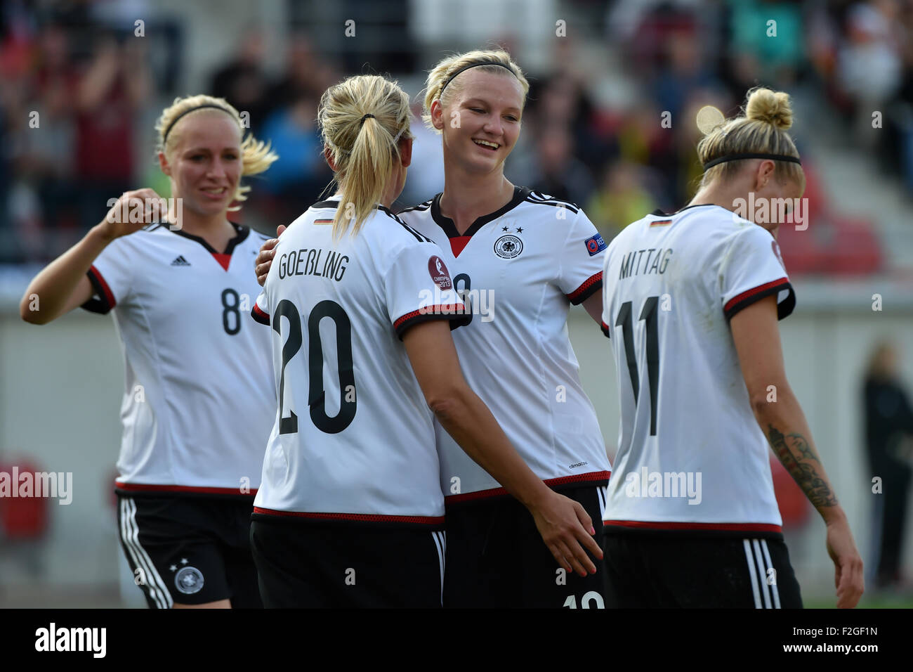 Women's Soccer European Championships Qualifications: Germany vs Hungary at the Erdgas Sportpark in Halle (Saale), Germany, 18 Septemeber 2015. Germany's (l-r) Pauline Bremer, Lena Goeßling, Alexandra Popp and Anja Mittag celebrate their win. Photo: HENDRIK SCHMIDT/DPA Stock Photo
