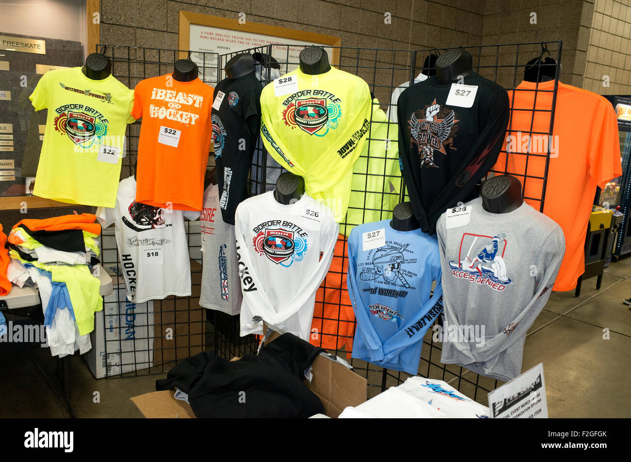 Rack of custom made logo hockey shirts at the St Croix Valley Recreation Center. Stillwater Minnesota MN USA Stock Photo