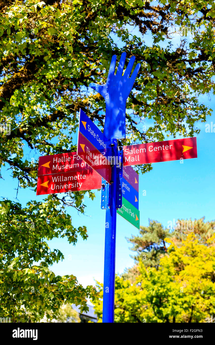 Colorful multisign pedestrian signpost in Salem, Oregon Stock Photo