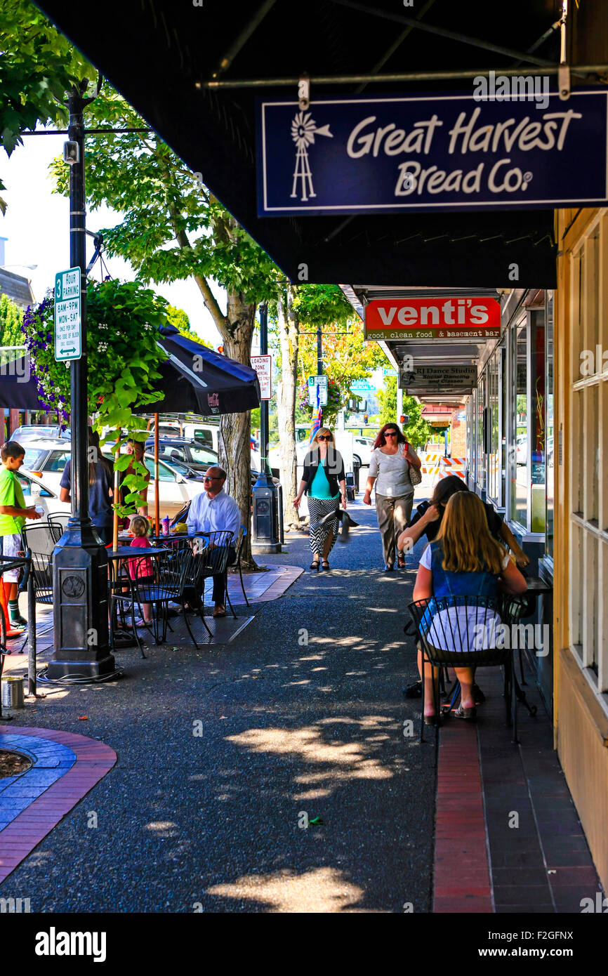 Undercover stores with people sitting outside enjoying the summer with a coffee and a snack on State Street in Salem Oregon Stock Photo