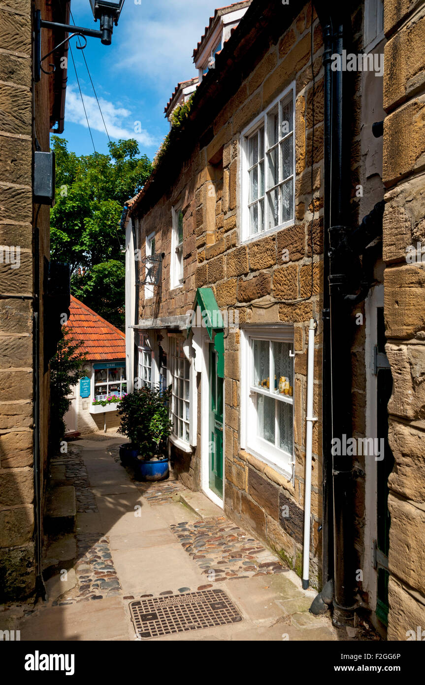 A house in one of the narrow passages, or allyways, in Robin Hood's Bay village.  Yorkshire, England, UK Stock Photo