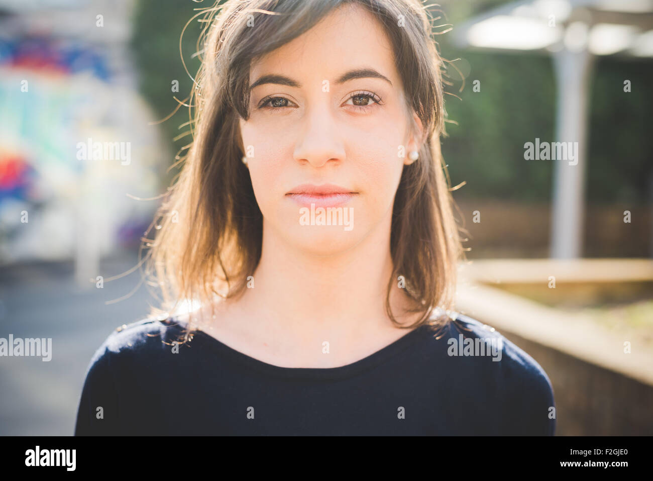 Portrait of a young pretty brown hair caucasian girl looking in camera - relax, happiness, carefreeness concept Stock Photo