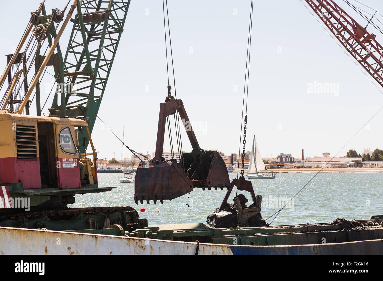 Ayamonte, Spain. 18th September, 2015. Dredging of Ayamonte marina which started on the 7th Sep 2015 after years of river erosion hindered access to the port for some boats at very high tides. It is planned that this will restore full access for the 316 moorings. Credit:  CBCK-Christine/Alamy Live News Stock Photo