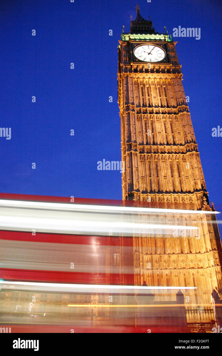 A view of Big Ben as a red london passes underneath Stock Photo